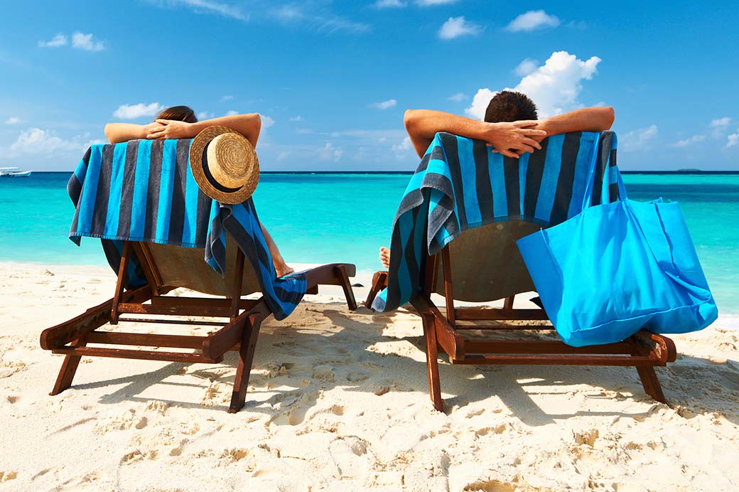 Couple relaxing on the beach